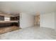 Open-concept living space with a kitchen featuring dark wood cabinets, connecting to a spacious area at 4752 Chip Shot Ln, Indianapolis, IN 46235