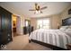 Spacious bedroom featuring neutral color palette, ceiling fan, and walk-in closet at 505 Shallowroot Ln, Sheridan, IN 46069