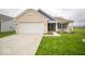 Charming single-story home with brick facade, attached garage, and well-maintained lawn at 505 Shallowroot Ln, Sheridan, IN 46069