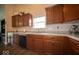 Gourmet kitchen featuring warm wood cabinets and stainless steel appliances at 505 Shallowroot Ln, Sheridan, IN 46069