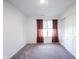 The empty bedroom has sliding closet door, window, and neutral colored walls at 509 Tulip Tree Dr, Lapel, IN 46051