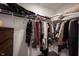 Organized walk-in closet with shelving and hanging storage for clothing and accessories at 509 Tulip Tree Dr, Lapel, IN 46051