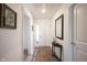 Inviting foyer with a decorative mirror, console table, and a patterned rug at 509 Tulip Tree Dr, Lapel, IN 46051