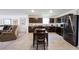 Kitchen with stainless steel refrigerator, wooden cabinets, and a table with chairs at 509 Tulip Tree Dr, Lapel, IN 46051
