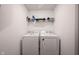 Functional laundry room equipped with a washing machine, dryer, and shelf at 509 Tulip Tree Dr, Lapel, IN 46051
