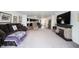 Comfortable living room features a fireplace, plush seating, and easy access to the kitchen at 509 Tulip Tree Dr, Lapel, IN 46051