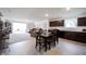 Open-concept living area combining a kitchen and living room with neutral color palettes at 509 Tulip Tree Dr, Lapel, IN 46051