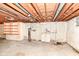 Unfinished basement featuring a utility sink at 5101 Dickson Rd, Indianapolis, IN 46226