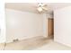 Bedroom with a ceiling fan and a closet featuring outdated carpet at 5101 Dickson Rd, Indianapolis, IN 46226