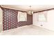 Bedroom with floral wallpaper, neutral carpet, chandelier, and windows with light pink curtain decor at 5101 Dickson Rd, Indianapolis, IN 46226
