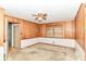 Bedroom with wood paneling, carpet, window with blinds and ceiling fan at 5101 Dickson Rd, Indianapolis, IN 46226