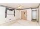 Bedroom includes a ceiling fan, mirrored closet, and floral patterned wallpaper accents at 5101 Dickson Rd, Indianapolis, IN 46226