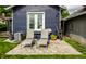 A patio with two chairs in the backyard at 5241 Guilford Ave, Indianapolis, IN 46220