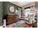 Bedroom with statement wall, comfortable armchair, and stylish decor at 5241 Guilford Ave, Indianapolis, IN 46220