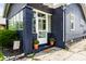 Inviting front entrance features a stylish door, potted plants, and a well-maintained walkway at 5241 Guilford Ave, Indianapolis, IN 46220