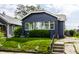 Charming single-story home featuring a well-manicured lawn, inviting entryway, and appealing exterior paint at 5241 Guilford Ave, Indianapolis, IN 46220