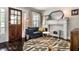 Inviting living room featuring a fireplace, comfortable sofa, and stylish decor at 5241 Guilford Ave, Indianapolis, IN 46220