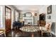 Bright living room boasts a decorative fireplace, ample seating, and a decorative rug at 5241 Guilford Ave, Indianapolis, IN 46220