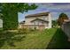 Home's backyard with deck and sunroom, and ample space for outdoor activities at 5351 Eel River Ct, Indianapolis, IN 46221