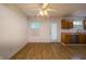 Bright dining area features wood floors, a ceiling fan, and ample natural light at 5351 Eel River Ct, Indianapolis, IN 46221