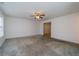 Neutral living room with ceiling fan and view of the entryway at 5351 Eel River Ct, Indianapolis, IN 46221