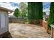 Backyard deck with wooden railing offering a serene view of the surrounding greenery at 5351 Eel River Ct, Indianapolis, IN 46221