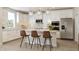 Bright kitchen with white cabinets, stainless steel appliances, granite countertops and modern globe pendant lighting at 5774 Cloister Ln, McCordsville, IN 46055
