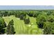 Scenic aerial view of a golf course with lush green fairways and mature trees at 5800 Lawrence Dr, Indianapolis, IN 46226