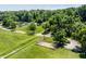 Community park aerial view featuring covered picnic area, mature trees, and winding trails at 5800 Lawrence Dr, Indianapolis, IN 46226