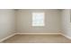 Neutral bedroom with a window and carpeted floor at 5800 Lawrence Dr, Indianapolis, IN 46226