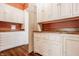Butler's pantry showcases ample white cabinets and drawers, wood countertops, and hardwood floors at 5800 Lawrence Dr, Indianapolis, IN 46226