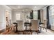 Formal dining room boasting elegant chandelier, patterned wallpaper, and seating for six at 5800 Lawrence Dr, Indianapolis, IN 46226