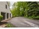 Wide driveway with basketball hoop and large grassy area offers ample space for outdoor activities at 5800 Lawrence Dr, Indianapolis, IN 46226