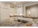 Granite countertops and stainless steel sink on the large kitchen island at 5800 Lawrence Dr, Indianapolis, IN 46226