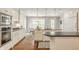 Bright kitchen with stainless appliances, granite countertops and breakfast nook with view to backyard at 5800 Lawrence Dr, Indianapolis, IN 46226