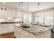 Spacious kitchen with stainless steel appliances, island, and view to backyard at 5800 Lawrence Dr, Indianapolis, IN 46226