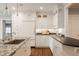 Well-lit kitchen with granite countertops, stainless steel appliances, and ample white cabinets at 5800 Lawrence Dr, Indianapolis, IN 46226