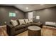 Cozy living room with a plush sofa, jute rug, and a round wood coffee table, creating an inviting space at 5800 Lawrence Dr, Indianapolis, IN 46226