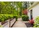 Charming walkway leading to home, accented by lush landscaping and vibrant foliage at 5800 Lawrence Dr, Indianapolis, IN 46226