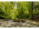 Inviting outdoor water feature with stone-lined pond, perfect for relaxing in a natural setting at 5800 Lawrence Dr, Indianapolis, IN 46226