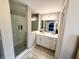 Bathroom featuring a glass-enclosed tiled shower, vanity with storage, and modern fixtures for a spa-like experience at 6309 Harvey Dr, Plainfield, IN 46168