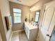 Cozy bathroom with a window for natural light, vanity with sink, and decorative towels adding a pop of color at 6309 Harvey Dr, Plainfield, IN 46168