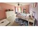 Charming bedroom with light purple walls, white furniture, carpeted floors, and ceiling fan offering a cozy retreat at 6309 Harvey Dr, Plainfield, IN 46168