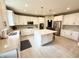 Bright kitchen featuring granite countertops, stainless steel appliances, and a kitchen island at 6309 Harvey Dr, Plainfield, IN 46168
