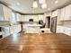 Spacious kitchen with an island, granite countertops, stainless steel appliances, and white cabinetry at 6309 Harvey Dr, Plainfield, IN 46168
