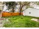 Private backyard area with grassy lawn and a white vinyl sided outbuilding at 647 Coffey St, Indianapolis, IN 46221