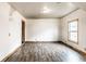Bright bedroom features wood-look flooring and a window for natural light at 647 Coffey St, Indianapolis, IN 46221
