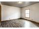 Light and airy bedroom with laminate flooring and great natural light at 647 Coffey St, Indianapolis, IN 46221