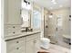 Beautiful bathroom with white cabinets, granite countertops, and a glass-enclosed shower at 6505 Miramar Ct, Indianapolis, IN 46250