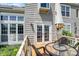 Relaxing deck area featuring an outdoor table, umbrella and chairs, easily accessible through double doors at 6505 Miramar Ct, Indianapolis, IN 46250
